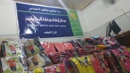مركز ارشاد النجف : توزيع 120 قطعه ملابس على العوائل المتعففه من الايتام