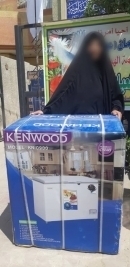 فرع مدينة الصدر: تسليم تبرعات من السيدة / نزهت الحسني