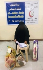 فرع مدينة الصدر : اليتيم حسين يحصل على كفالته الشهرية من السيدة ( ل ، ش )