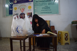 فرع النجف :-  تسليم الاعانه لاسره السيدة / فليحه . ع . ع من السيده / عاليه جواد