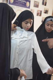 فرع النجف :-  تسليم المساعده  الماليه لاسره السيده / هدى . س . م  