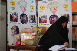 فرع النجف :- تسليم الاعانه لاسره الارمله / راجحه . ج . ط من قبل السيد / انمار