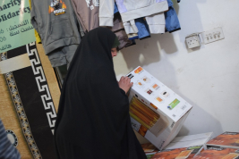 فرع النجف :-  تسليم الاعانه لاسره المتعففه / هديل . ح . ك من قبل السيد / بهاء الموسوي