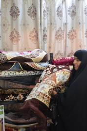 فرع النجف :-  تسليم الاعانه لاسره السيدة / فليحه . ع . ع من السيده / عاليه جواد