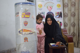 فرع النجف :-  تسليم التبرع الوارد لاسره السيدة / كريمه . م . ر من قبل السيده  / سهى شبر