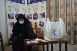 فرع النجف :- تسليم الاعانه لاسره السيدة / نوره . ع . ا من قبل السيد / هيثم كبه 