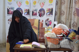 فرع النجف :- تسليم الكفالة الشهريه لاسره السيده / ماليه . ك . ع من قبل السيده / سهى شبر