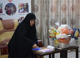 فرع النجف :- تسليم التبرع المالي من السيده / رجاء كبه 