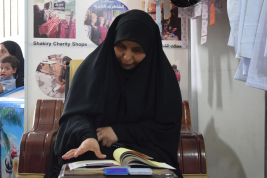 فرع النجف :-  تسليم الاعانه لاسره الارمله / راجحه . ج . ط من قبل السيدة / مي كبه 