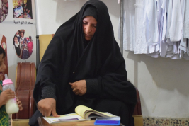 فرع النجف :-  تسليم الاعانه لاسره المتعففه / ماجده . ا . ج من قبل السيده / مي كبه 