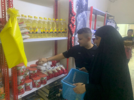 فرع البياع : تسليم المساعدة المالية المقدمة من ام معد للارملة ( دلال ح ) 
