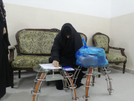 فرع النجف: تسليم الكفالة الشهرية المقدمة من (السيدة / عالية جواد)